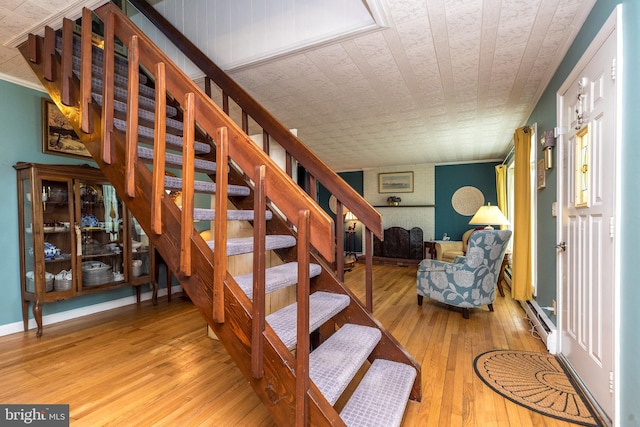 stairway featuring hardwood / wood-style floors