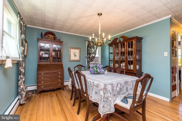 dining area with an inviting chandelier, a baseboard radiator, hardwood / wood-style flooring, and crown molding