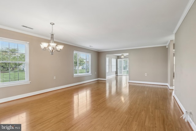 interior space featuring visible vents, a healthy amount of sunlight, and crown molding