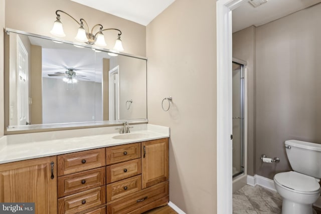 full bathroom featuring a shower stall, toilet, vanity, baseboards, and a ceiling fan