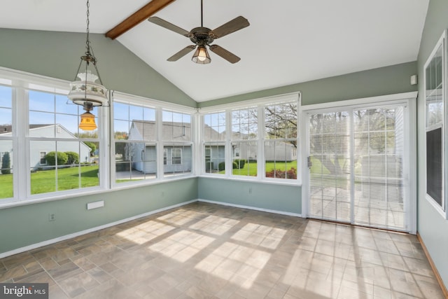 unfurnished sunroom with vaulted ceiling with beams and baseboards