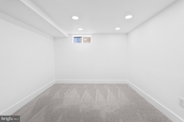 below grade area featuring baseboards, recessed lighting, and carpet flooring
