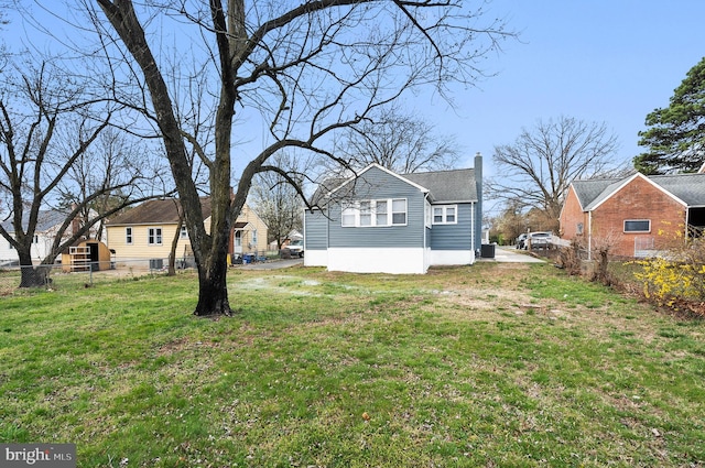 view of yard with fence and cooling unit