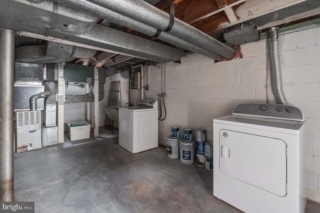 unfinished basement with washing machine and dryer