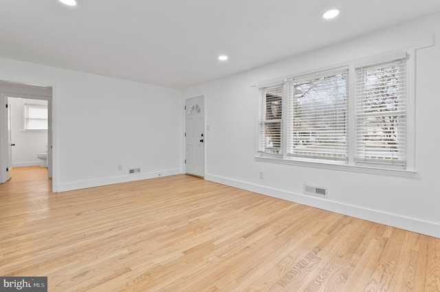 unfurnished living room with visible vents, light wood-type flooring, recessed lighting, and baseboards