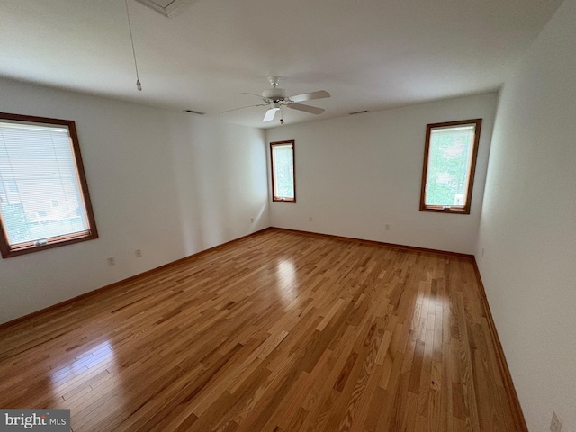 29 Salt Grass Rd, Ocean Pines, MD 21811 - empty room featuring light wood-type flooring, attic access, baseboards, and ceiling fan