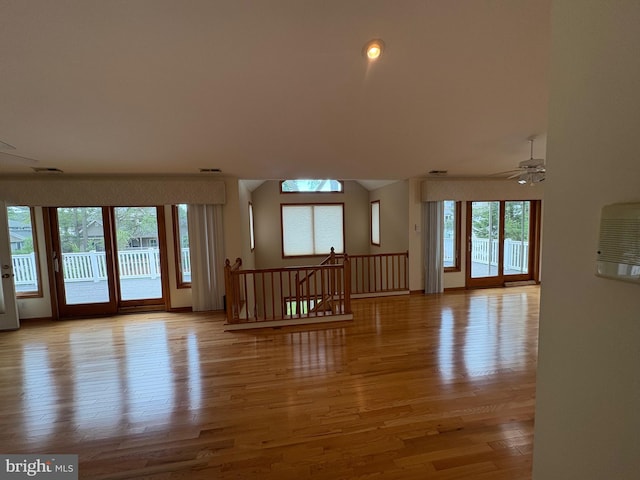 29 Salt Grass Rd, Ocean Pines, MD 21811 - unfurnished living room with light wood-style floors, a ceiling fan, and vaulted ceiling