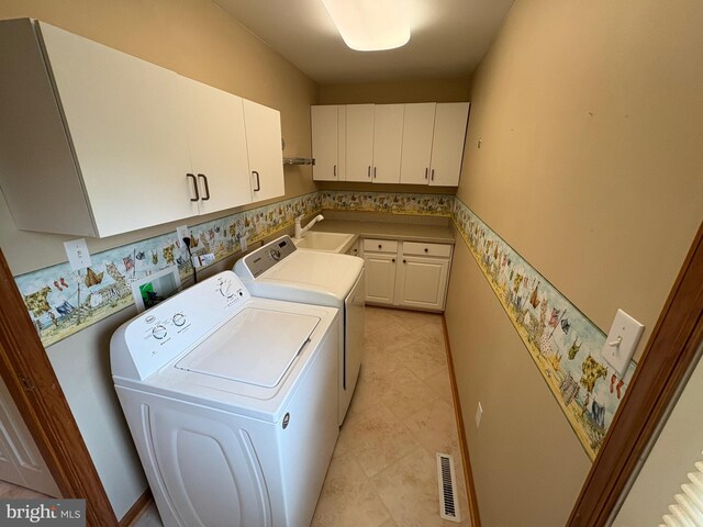 29 Salt Grass Rd, Ocean Pines, MD 21811 - laundry area with cabinet space, independent washer and dryer, and light tile patterned floors