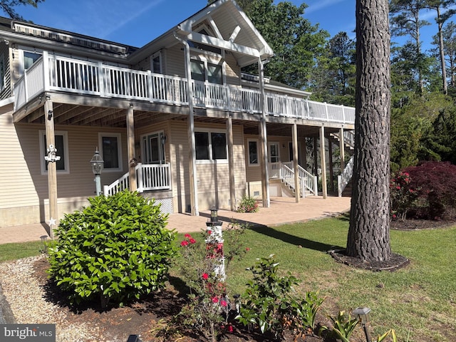 29 Salt Grass Rd, Ocean Pines, MD 21811 - view of front of property featuring a front yard, stairway, and a wooden deck