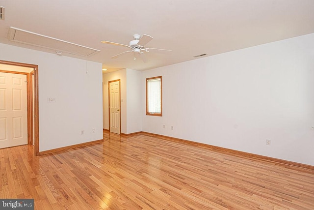 29 Salt Grass Rd, Ocean Pines, MD 21811 - spare room featuring attic access, light wood finished floors, ceiling fan, and baseboards