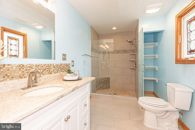 29 Salt Grass Rd, Ocean Pines, MD 21811 - full bath with toilet, vanity, a tile shower, decorative backsplash, and baseboards