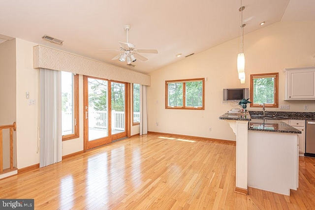 29 Salt Grass Rd, Ocean Pines, MD 21811 - kitchen featuring lofted ceiling, light wood-style flooring, ceiling fan, pendant lighting, and white cabinetry
