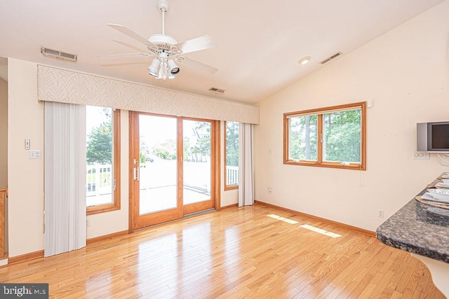 29 Salt Grass Rd, Ocean Pines, MD 21811 - unfurnished living room with vaulted ceiling, healthy amount of natural light, light wood finished floors, ceiling fan, and baseboards