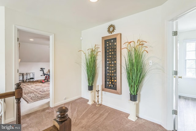 foyer featuring recessed lighting, carpet, and baseboards