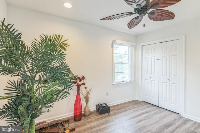 interior space with recessed lighting, light wood finished floors, and baseboards