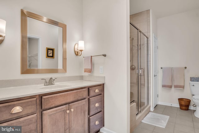 323 Valor Dr, Mechanicsburg, PA 17050 - bathroom with vanity, toilet, tile patterned floors, baseboards, and a stall shower