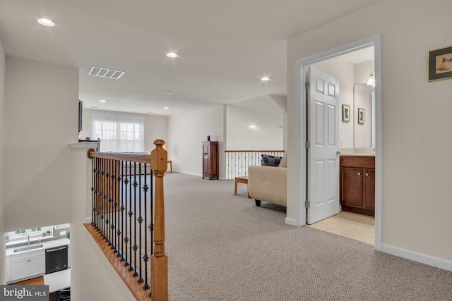 323 Valor Dr, Mechanicsburg, PA 17050 - corridor featuring visible vents, light colored carpet, recessed lighting, a sink, and an upstairs landing