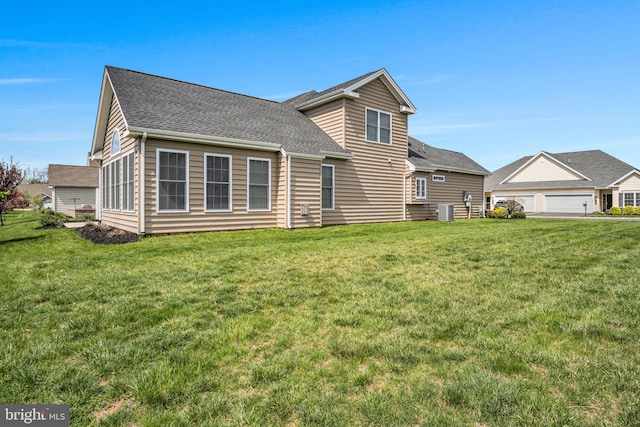323 Valor Dr, Mechanicsburg, PA 17050 - rear view of property featuring a lawn, central AC unit, and roof with shingles