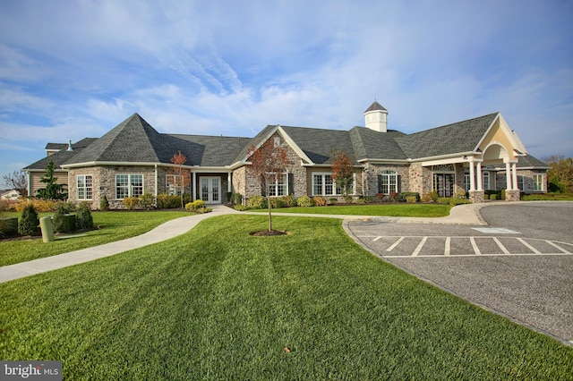 323 Valor Dr, Mechanicsburg, PA 17050 - view of front of house featuring a front yard, french doors, stone siding, and a chimney