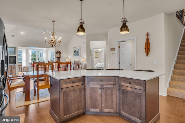 323 Valor Dr, Mechanicsburg, PA 17050 - kitchen with light wood-style floors, light countertops, and vaulted ceiling