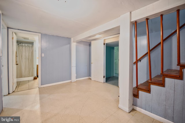 100 9th Ave, Baltimore, MD 21225 - finished basement with stairs, baseboards, and tile patterned floors
