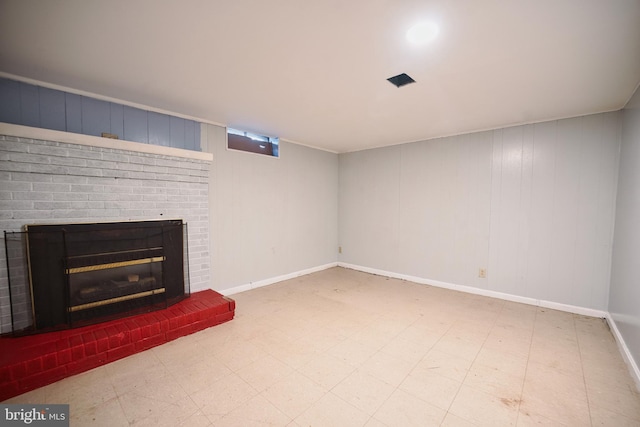 unfurnished living room featuring tile patterned floors, baseboards, and a fireplace