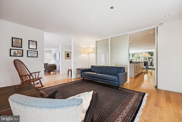 living area featuring recessed lighting and light wood-type flooring