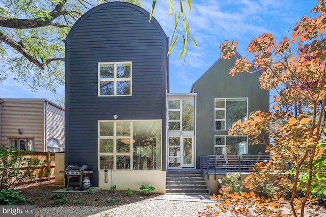 exterior space with fence and stucco siding