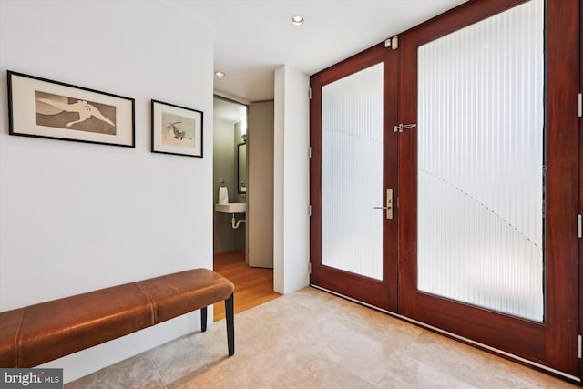 interior space with recessed lighting, light tile patterned flooring, and french doors