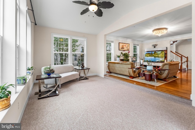 sitting room featuring ceiling fan, baseboards, carpet floors, and lofted ceiling