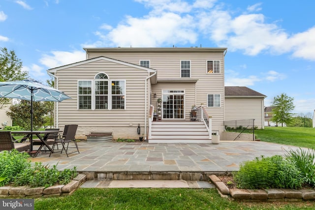 rear view of house featuring a patio