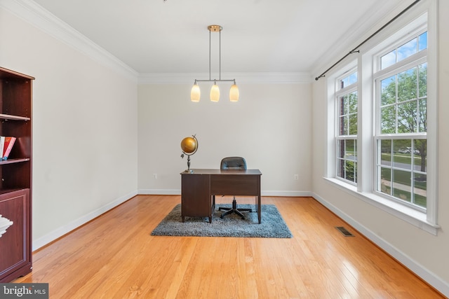 office featuring wood finished floors, crown molding, and baseboards