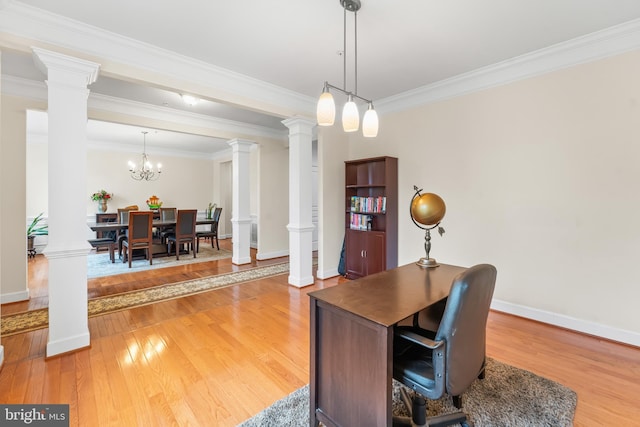 office space featuring light wood-style flooring, decorative columns, crown molding, and baseboards