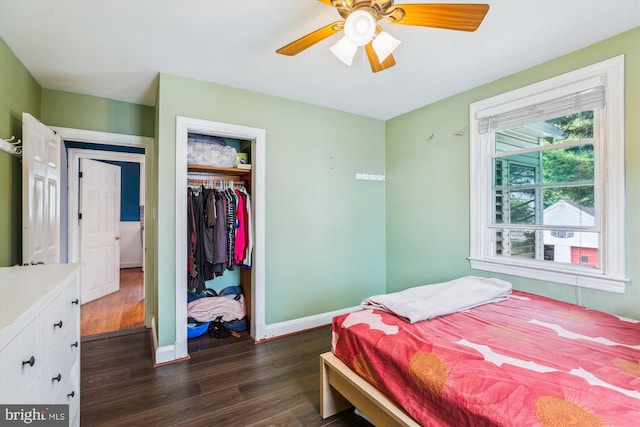 5218 Arbutus Ave, Baltimore, MD 21227 - bedroom with dark wood-type flooring, a closet, baseboards, and a ceiling fan