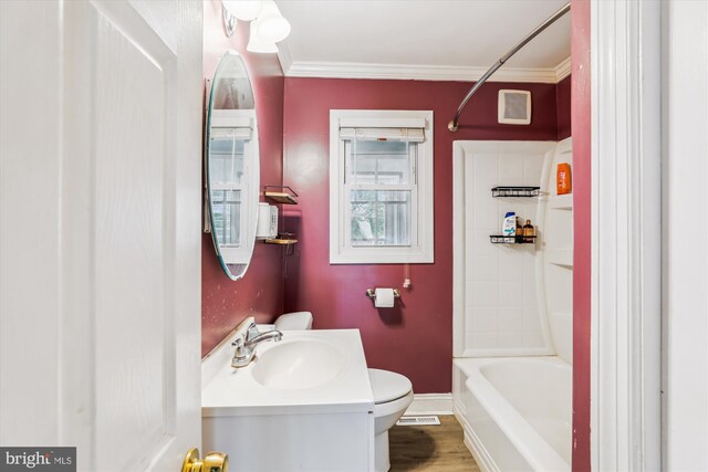 5218 Arbutus Ave, Baltimore, MD 21227 - bathroom with ornamental molding, toilet, vanity, and shower / washtub combination