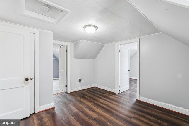 5218 Arbutus Ave, Baltimore, MD 21227 - bonus room featuring wood finished floors, baseboards, and vaulted ceiling