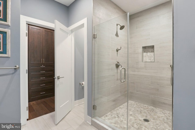 207 Reid Way, West Chester, PA 19382 - bathroom featuring baseboards, tile patterned floors, and a stall shower