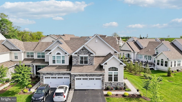 207 Reid Way, West Chester, PA 19382 - view of front of house with a garage, a residential view, driveway, and stone siding