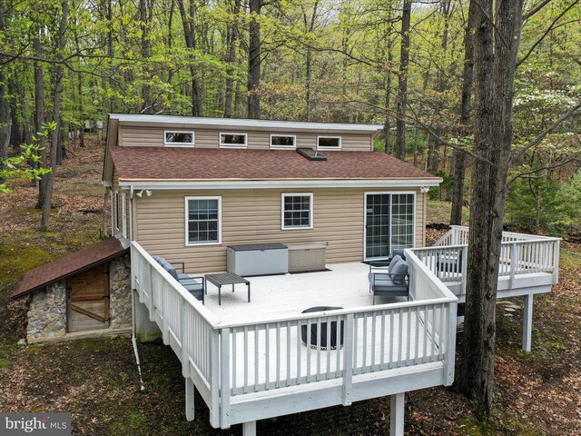 659 Settlers Valley Way, Lost River, WV 26810 - back of house featuring a shingled roof, a deck, and a forest view