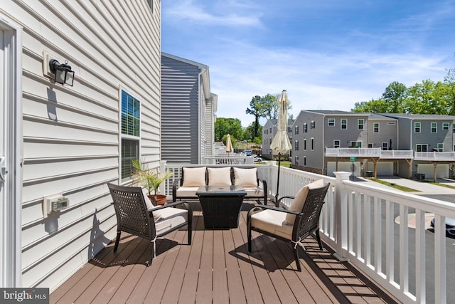 wooden deck featuring an outdoor living space
