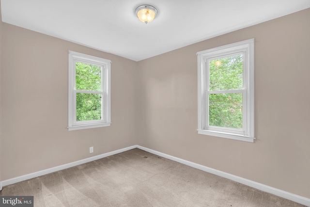 1007 Madison Ct, Annapolis, MD 21403 - carpeted empty room featuring baseboards and plenty of natural light