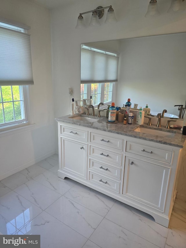 903 Lake Front Dr, Bowie, MD 20721 - bathroom featuring a sink, marble finish floor, and a wealth of natural light
