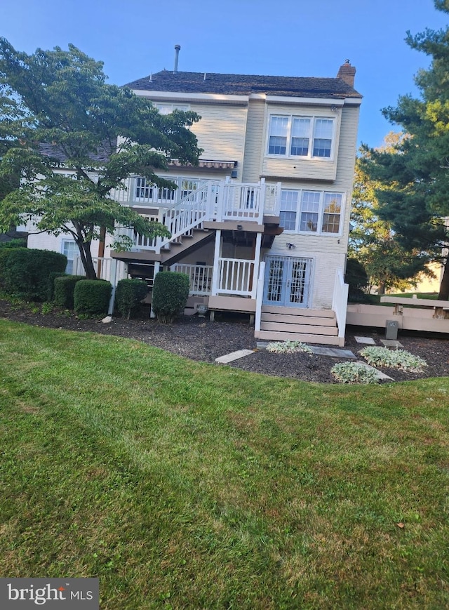 903 Lake Front Dr, Bowie, MD 20721 - back of property featuring stairway, a yard, a chimney, and a deck