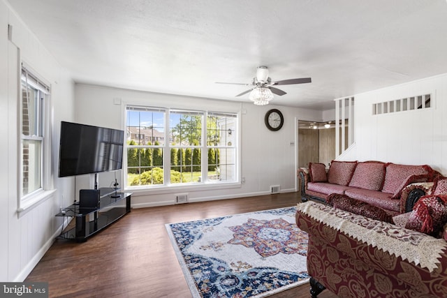 living room with ceiling fan, visible vents, a healthy amount of sunlight, and wood finished floors