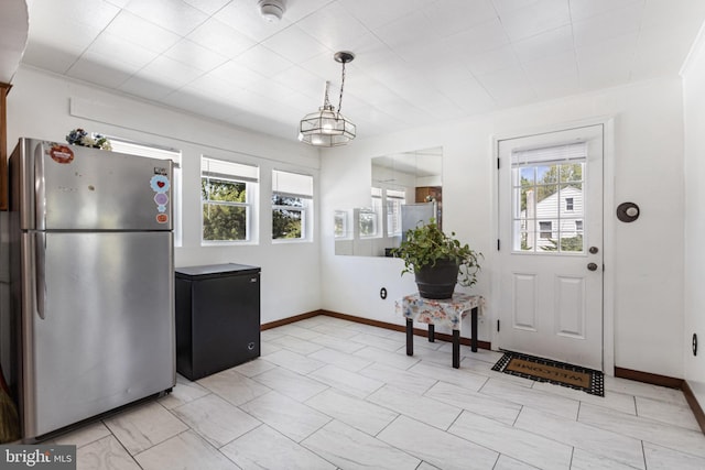 interior space with baseboards