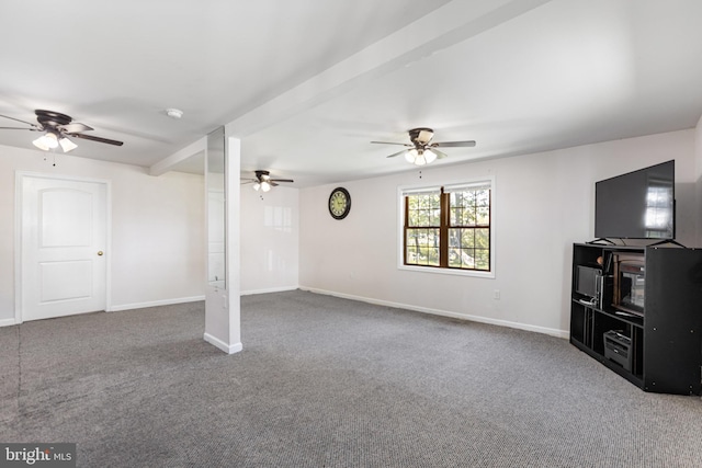 unfurnished living room featuring baseboards, a ceiling fan, and carpet flooring