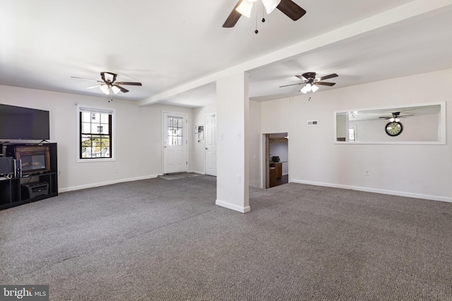 unfurnished living room with baseboards, a ceiling fan, carpet flooring, and visible vents