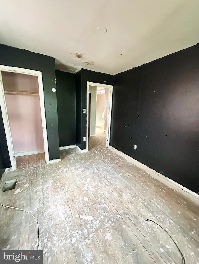 316 Atlantic St SE, Washington, DC 20032 - unfurnished bedroom with a closet and hardwood / wood-style floors