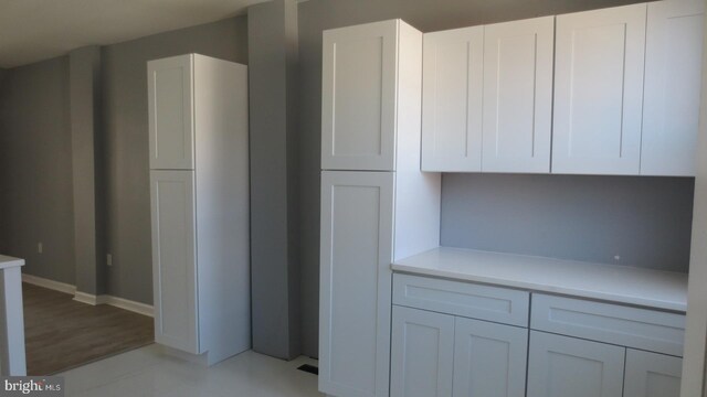 1839 E Pastorius St, Philadelphia, PA 19138 - kitchen featuring baseboards, white cabinets, and light countertops