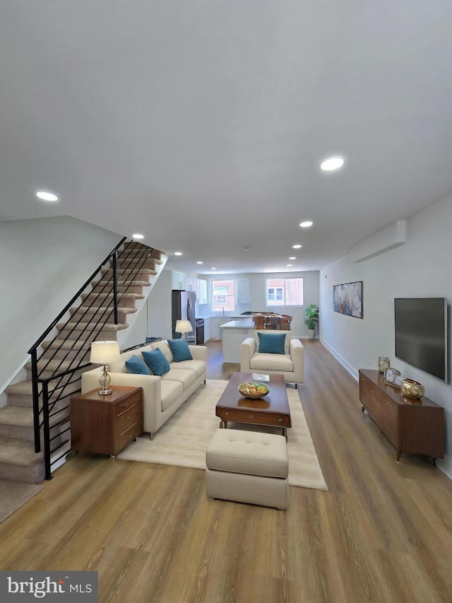 1055 E Cheltenham Ave, Philadelphia, PA 19124 - living room with wood finished floors, recessed lighting, and stairs
